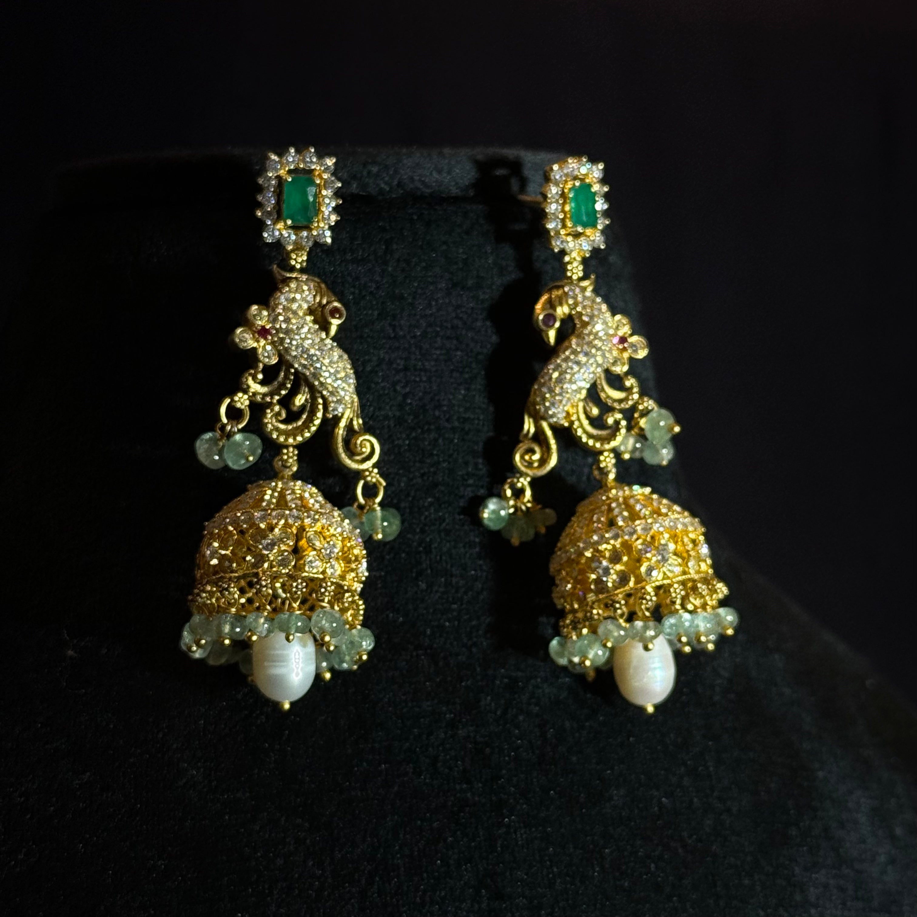 Elegant Peacock Jhumka Earrings in High-Polish Silver